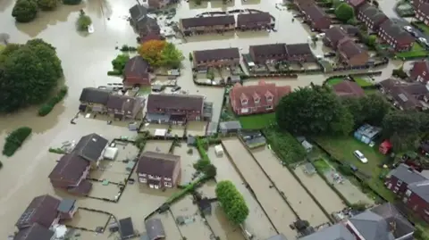 Malik Walton/BBC A drone image of flooding in Catcliffe