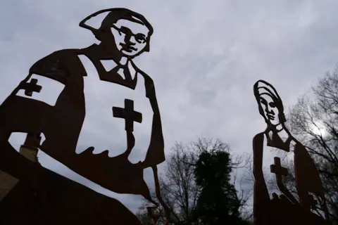 Dawid Wojtowicz Giant silhouettes of the nurses who died in the D-Day campaignn