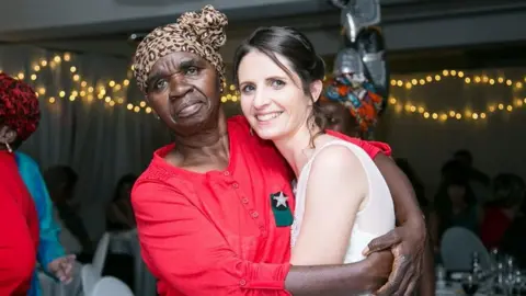 Kyla Mills Ma Lina hugs Kyla Mills