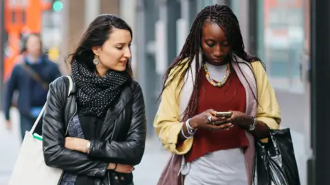 Getty Images Two women walking