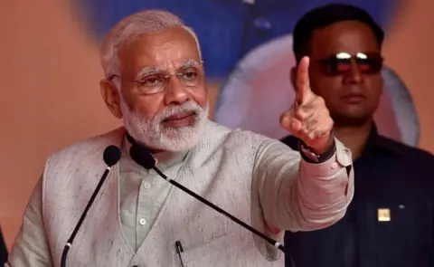 Getty Images Prime Minister Narendra Modi addressing BJP party workers during a public meeting on October 29, 2017 in Bengaluru.