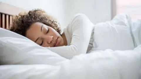 Getty Images Asleep in bed