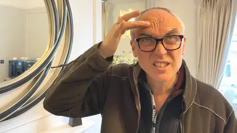 BBC Ed Butler checking out his wrinkles