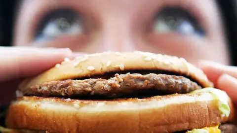 Getty Images Close up of a fast-food burger