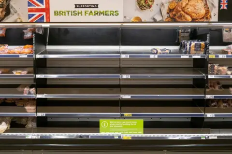 Getty Images Empty shelves in an ASDA store on October 9, 2021 in Cardiff,