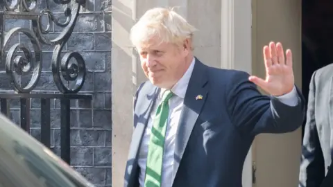 PA Media Boris Johnson waving