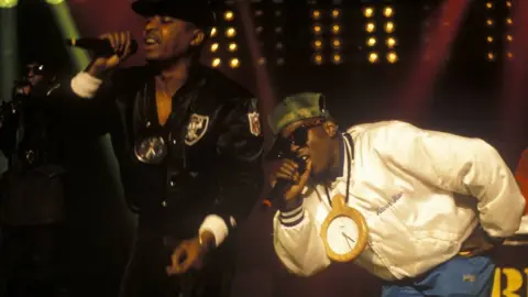 Suzie Gibbons/Getty Chuck D and Flavor Flav of Public Enemy performing at the Montreux Jazz Festival in 1988