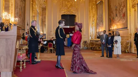 Cornwall Partnership NHS Foundation Trust Charity Gladstone receiving her MBE from the Princess Royal