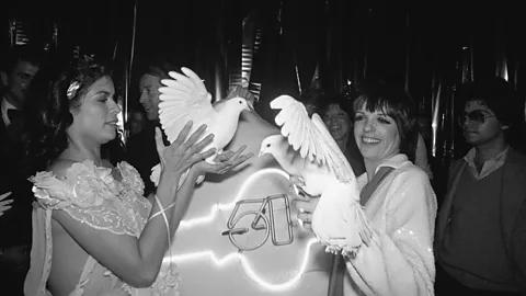 Before the Emanuels became well-known, Bianca Jagger was pictured in one of their dresses with Liza Minnelli at Studio 54 (Credit: Getty Images]