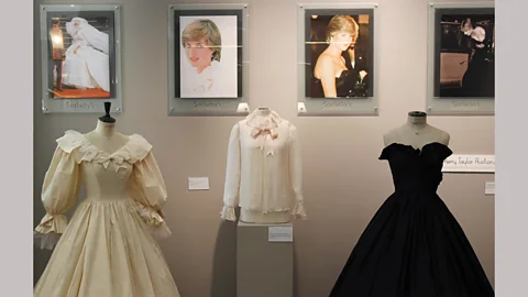 Getty Images Princess Diana’s wedding gown, along with the pink chiffon blouse and the black taffeta gown she wore before she got married – all designed by the Emanuels (Credit: Getty Images)