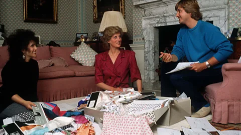 Getty Images Princess Diana with Elizabeth and David Emanuel at Kensington Palace in 1986, choosing outfits for a royal tour (Credit: Getty Images)