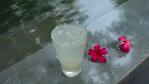 Menty Jamir Glass of lemonade with two red flowers (Credit: Menty Jamir)