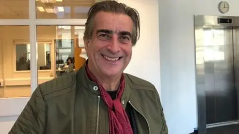 BBC Josh Phillips standing in the BBC newsroom in Southampton