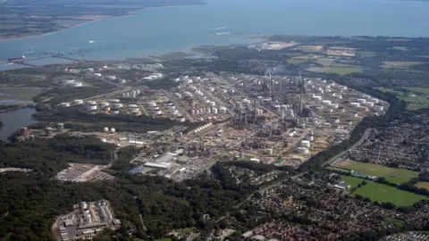 Getty Images Fawley Refinery and Petrochemical Complex is pictured from the window of an aeroplane, many buildings can be seen and smoke pouring from chimneys at the complex