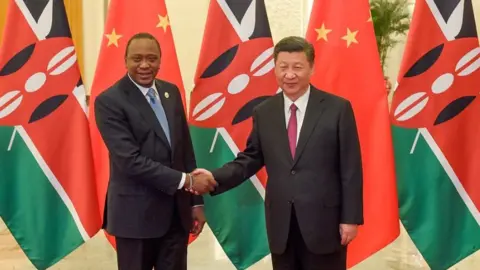 AFP Chinese President Xi Jinping shakes hands with Kenyan President Uhuru Kenyatta prior to their bilateral meeting during the Belt and Road Forum for International Cooperation at the Great Hall of the People in Beijing on May 15, 2017.