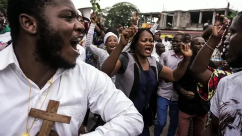 AFP Catholics sing and dance during a December 31, 2017 demonstration to call for the President of the Democratic Republic of the Congo to step down.