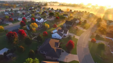 Getty Images Sunrise over sleepy neighbourhood