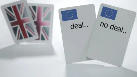 Getty Images Playing cards with "deal" or "no deal" written on them