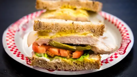 Getty Images Close up of Sandwich on brown placed on a plate