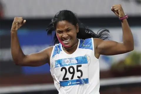 EPA Swapna Barman of India celebrates after the 800m event of the Heptathlon at the 2018 Asian Games in Jakarta, Indonesia, 29 August 2018