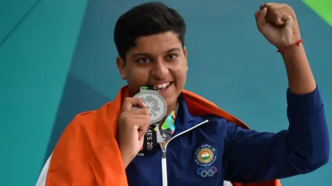 Getty Images India's Shardul Vihan poses with his silver medal at the awards ceremony following the men's shooting double trap final at the 2018 Asian Games in Palembang on August 23, 2018.