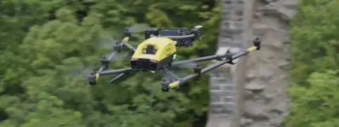 A drone flies over the Great Wall of China