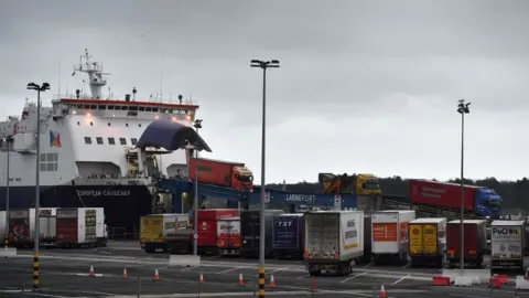 Getty Images Lorries driving off a ferry in Larne
