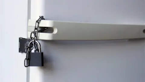 Getty Images Padlock on a fridge