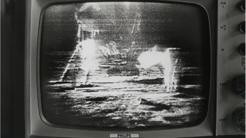 Getty Images landing on the moon on television screen on the 21st of July 1969