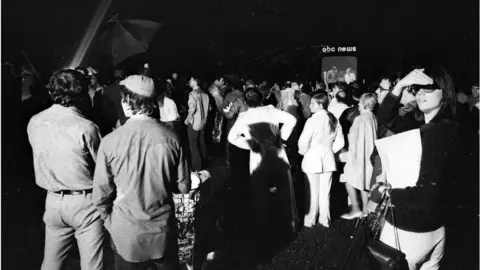 Getty Images Spectators gather at Central Park in New York, New York to watch reports of the Apollo 11 moon landing on one of the three giant television screens set up by the major networks on July 20, 1969