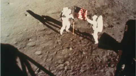 Getty Images Armstrong and Aldrin unfurl the US flag on the moon, 1969