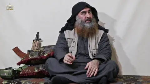 AFP Screengrab of video released on 30 April 2019 showing Abu Bakr al-Baghdad at an undisclosed location