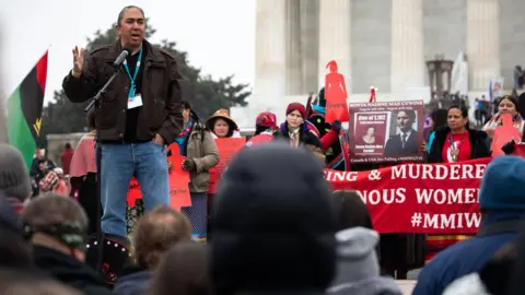 Shane Bahn Mark Charles speaks at an indigenous people's march in Washington DC