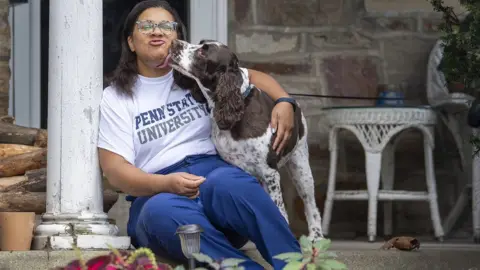 Jose Moreno Meryl Daly-Parker, a nurse in East Norriton, Pennsylvania: sitting with her dog
