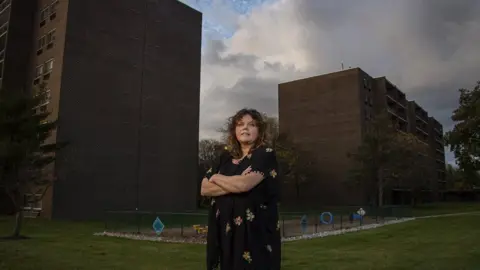 Jose Moreno Kim Kriebel, shown at her apartment block