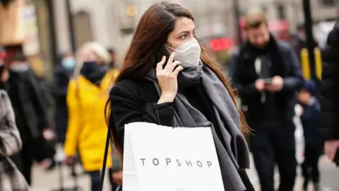 Getty Images Woman carrying Topshop bag