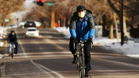 Getty Images Cyclist in Denver, Colorado on Thursday. December 17, 2020