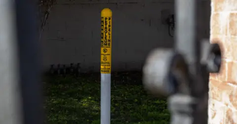 Christian Monterrosa A pipeline that signals "Warning Petroleum Pipeline" close to Nalleli's childhood home.