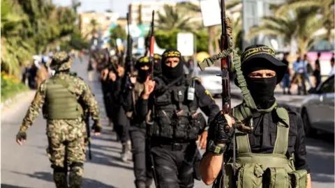 Getty Images Palestinian militants in Gaza City (file photo)