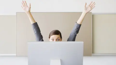 Getty Images woman at her desk