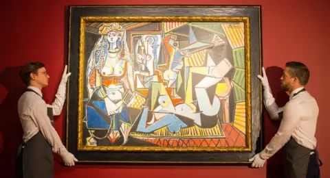 PA Media Gallery staff at Christie"s London showroom hang Les femmes d'Alger (The Women of Algiers) by Pablo Picasso in 2015