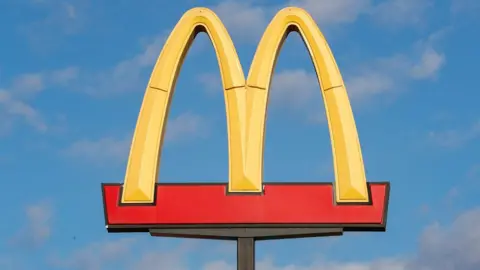 Getty Images A view of a McDonald's food restaurant logo sign.