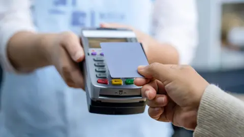 Getty Images customers paying a bill