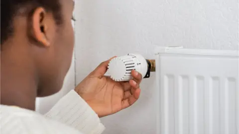 Getty Images Adjusting a radiator