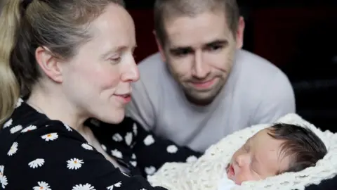Helen Mary Inages  Lora and Neil Fachie with baby Fraser