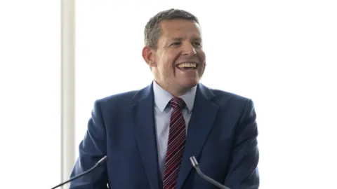 Matthew Horwood/Getty Images Rhun ap Iorwerth giving his acceptance speech in Cardiff Bay.