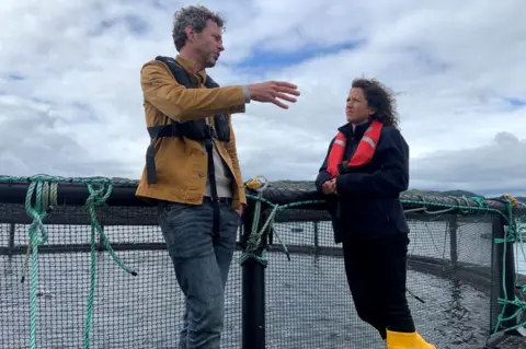 BBC Andrew Cannon, of Kames Fish Farming, speak to Mairi Gougeon