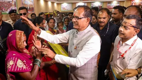 PTI Madhya Pradesh Chief Minister Shivraj Singh Chouhan during the amount distribution of Ladli Bahna Yojana, in Jabalpur.