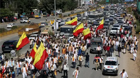 K Venkatesh The activists were demanding that billboards feature Kannada prominently