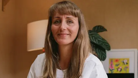 Naomi Woods Image of Alice Ballantine Dykes. She is looking directly at the camera and smiling.